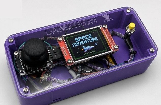 An assembled purple Gametron with a clear lid, running a game called Space Adventure