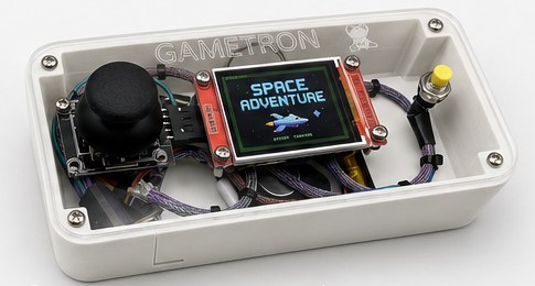 A white Gametron console with the lid on