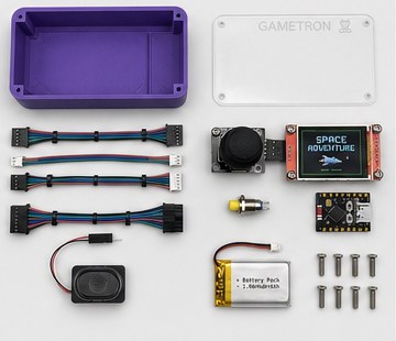 The kit laid out: case, clear lid, cables, joystick, screen, button, controller board, speaker, battery and screws